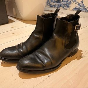 Used Prada black men’s boots. 7.5 Prada size. About equivalent to 9.5 US.